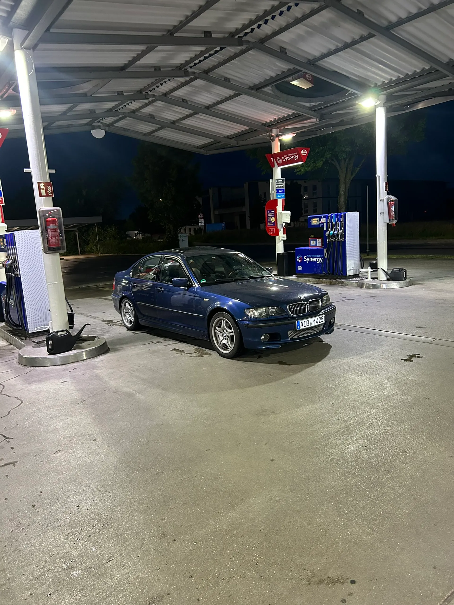 BMW E46 325i Sedan side profile under station lights